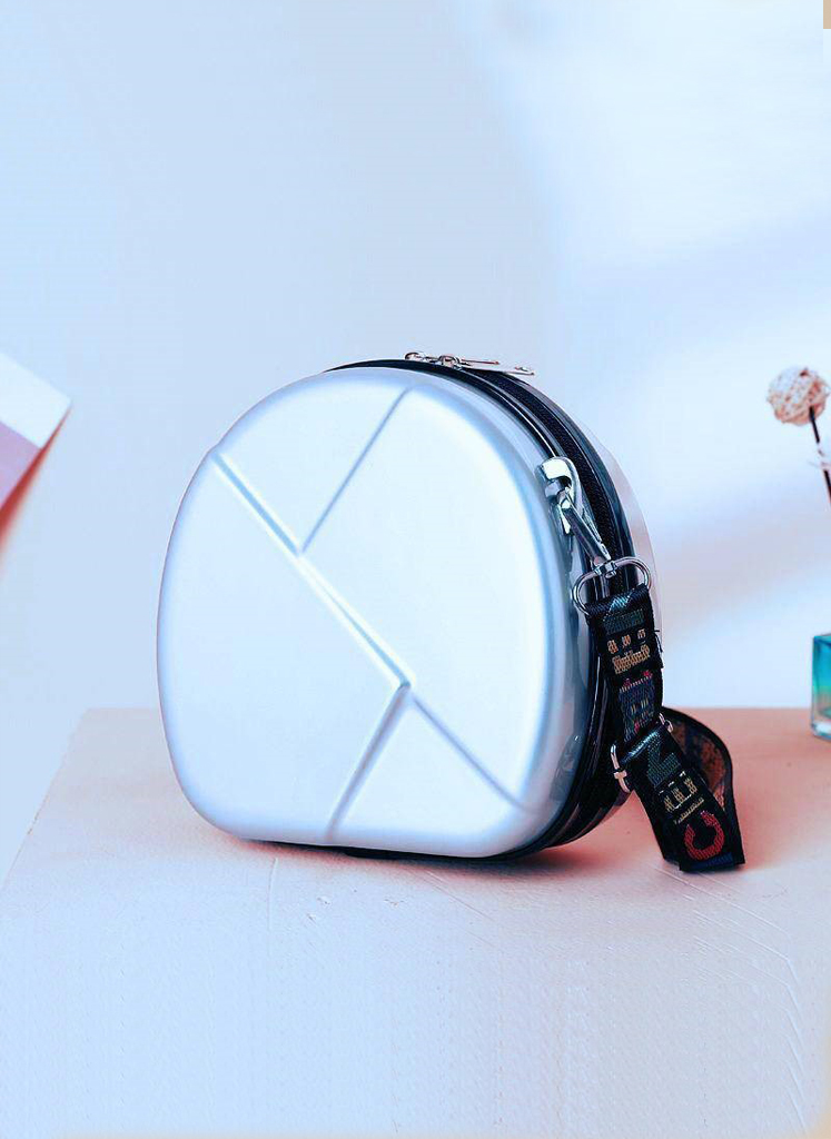 17 Bolsa de mano, Silver Hardshell Round bag w/ colorful strap. - Image 1