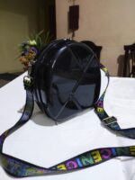 Bolsa de mano, Black Hardshell Round bag w/ colorful strap. - Image 2
