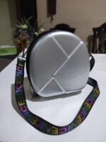 Bolsa de mano, Silver Hardshell Round bag w/ colorful strap. - Image 2